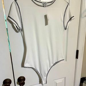 White body suit with black edging, size lg